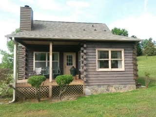 Rustic log cabin finished in Timberline Gray