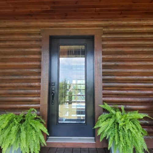 Log cabin door detail finished in Men-Wood Coatings
