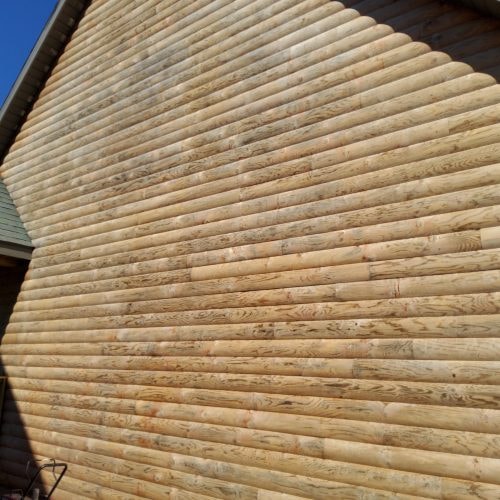 Log cabin siding finished in Men-Wood Coatings